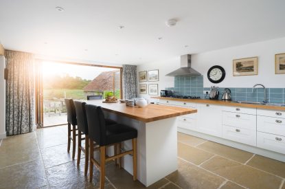 The kitchen with breakfast bar at Riverside Retreat, Devon