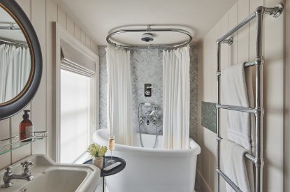 A bathroom with roll top bath at Harold House, Isle of Wight