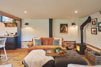 The living room with log burner at Farmstay Retreat, Hampshire