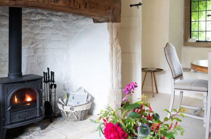 The log-burning stove in the reception room at Fig Tree Cottage, Cotswolds