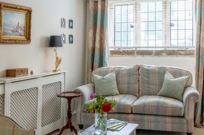 The two-seater sofa in the reception room at Fig Tree Cottage, Cotswolds