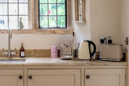 The kettle and the toaster in the kitchen at Fig Tree Cottage, Cotswolds