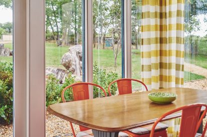 The dining table and chairs in the conservatory at Sunflower Cottage, Vale of Glamorgan