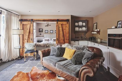 The two-seater sofa in the open-plan living space at Mimosa Cottage, Vale of Glamorgan