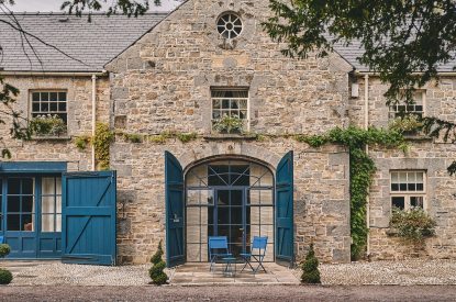 The entrance to the studio apartment and a table and chairs at Muscari Cottage, Vale of Glamorgan