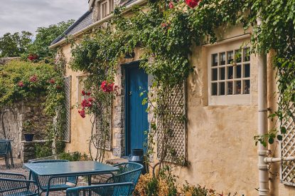 A shared seating area in the courtyard The exterior at Camassia Cottage, Vale of Glamorgan