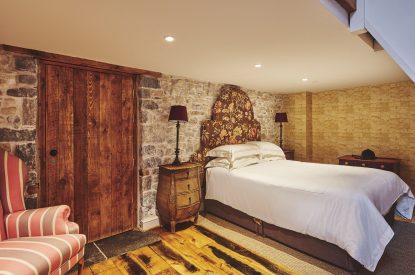 A king-size bedroom at Lotus Cottage, Vale of Glamorgan