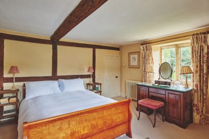 A king-size bedroom at Withington Grange, Cotswolds 