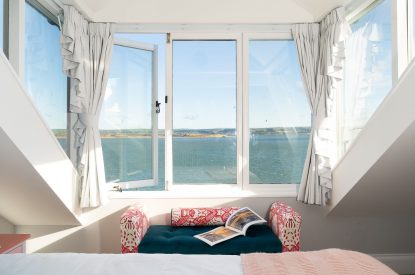 Views of the estuary in the master bedroom at Waters Dream, Devon