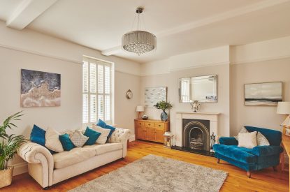 The living room with a log burner at Oakfield, Somerset