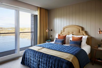 A double bedroom with lake view at The Reserve, Cotswolds