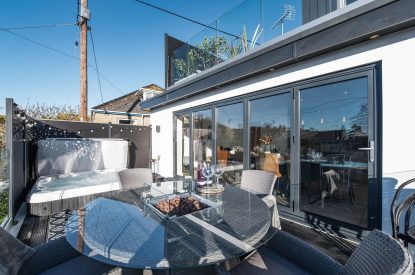The balcony with hot tub at Porthleven View, Cornwall