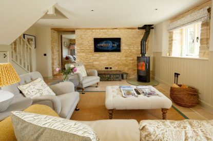 The living room with log burner at Orchard Stable, Cotswolds