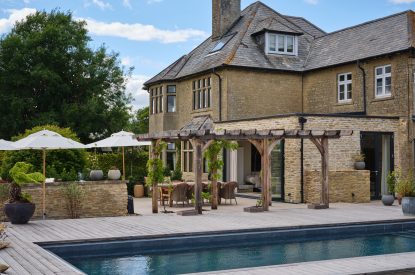The exterior and swimming pool at Lakeside Manor, Cotswolds