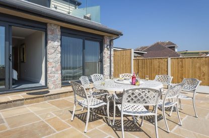 The outdoor dining area at Beesands Vista, Devon