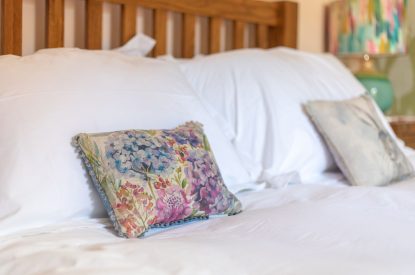 A double bed at Woodbury Cottage, Devon