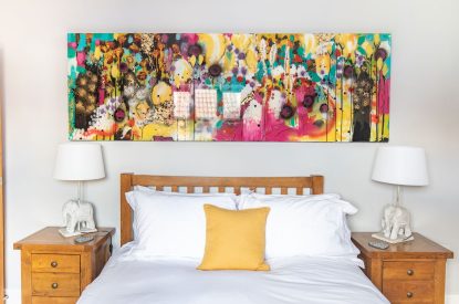 A bed at Woodbury Cottage, Devon