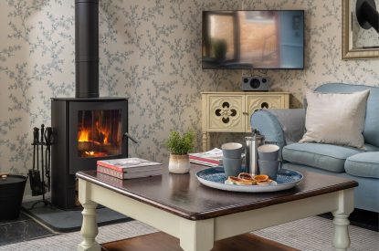 The living room with log burner at Cuckoo Cottage, Devon