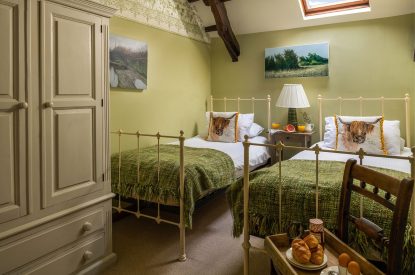 A twin bedroom at Honey Buzzard Farmhouse, Devon