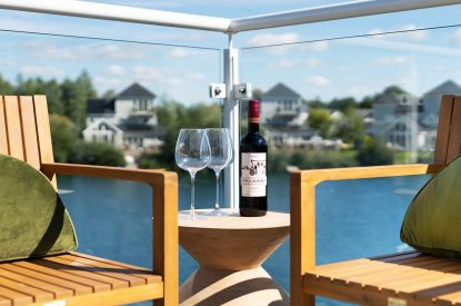 A sitting area on the balcony at Lakefront Lodge, Cotswolds