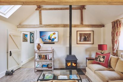 The living room with log burner at Jersey Barn, Chiltern Hills