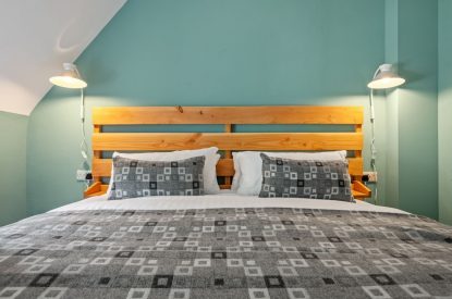 A bedroom at Teacher's Cottage, Gower