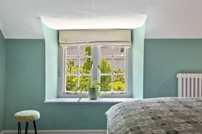A bedroom at Teacher's Cottage, Gower