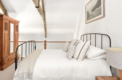 A double bedroom with oak beams at Chapel Cottage, Pembrokeshire