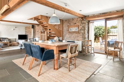 The dining room with doors onto the patio at Chapel Cottage, Pembrokeshire