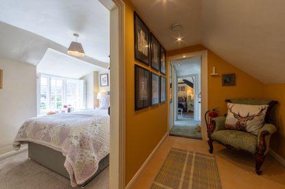 A hallway leading to a single bedroom at Thatch Corner, Somerset