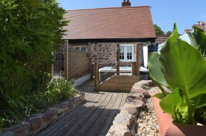 A pathway leading to the hot tub at Exmoor Barn, Somerset