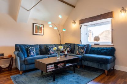 The living room with a corner sofa at Exmoor Barn, Somerset