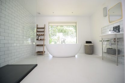 A large family bathroom with free standing bath at Brickworks and Vines, Isle of Wight