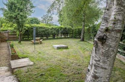The private garden surrounded by hedges at Farmyard Cottage, Wiltshire