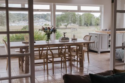 The living room leading to the dining table at Brickworks and Vines, Isle of Wight