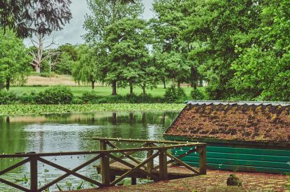 A bench beside the lake and overlooking the estate grounds at Steward's Cottage, Welsh Borders