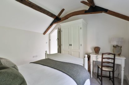 The dressing table and wardrobe in the master bedroom at Rambling Rose Cottage, Cotswolds