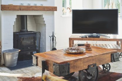 The log burner and coffee table in the living room at Osborne Lodge, Herefordshire
