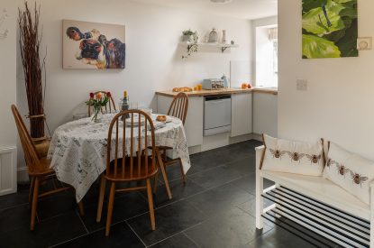 The dining table in the kitchen at The Milking Parlour, Wiltshire 