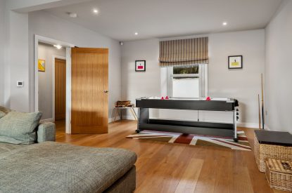 The living room/games room at Channel View, Oxwich