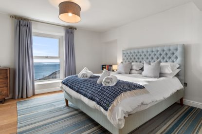 A super king size bedroom at Channel View, Oxwich 