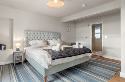 A super king size bedroom at Channel View, Oxwich 