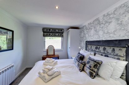 The king size bedroom at The Hunter's Lodge, Loch Lomond