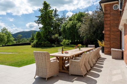 Outdoor dining table at The Vineyard Lake House, Malvern Hills