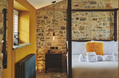 A king size bedroom at Puddle Duck Cottage, Somerset