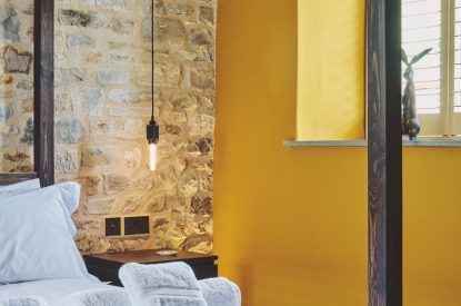 A king size bedroom at Puddle Duck Cottage, Somerset