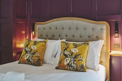 A king size bedroom at Puddle Duck Cottage, Somerset