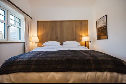 The super king size bedroom at Basket Makers Cottage, Roundstone, Galway