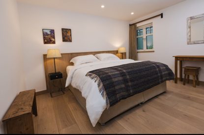 Super king size bedroom at Potter's Cottage, Roundstone, Galway