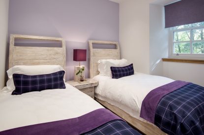 A twin bedroom at Lomond House, Loch Lomond